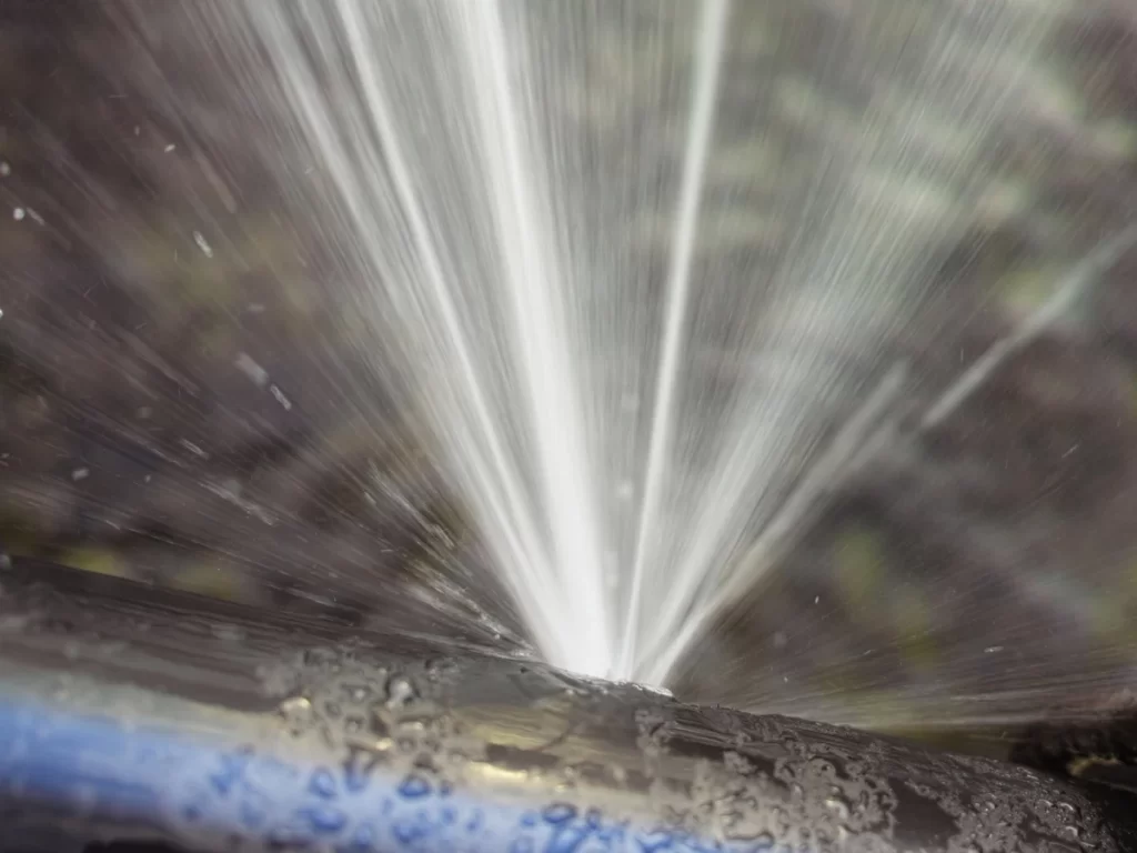 Image of a pipe burst indicating the need for immediate and essential plumbing repair