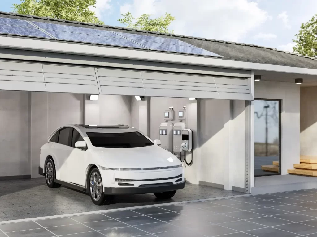 Image of a car in a home garage with an home EV charging station set up