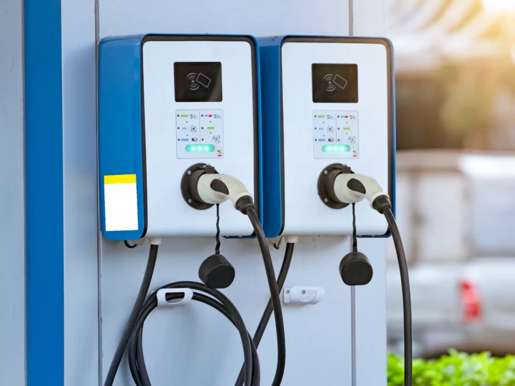 Image of a fast EV charger that can be seen on a public EV charging station