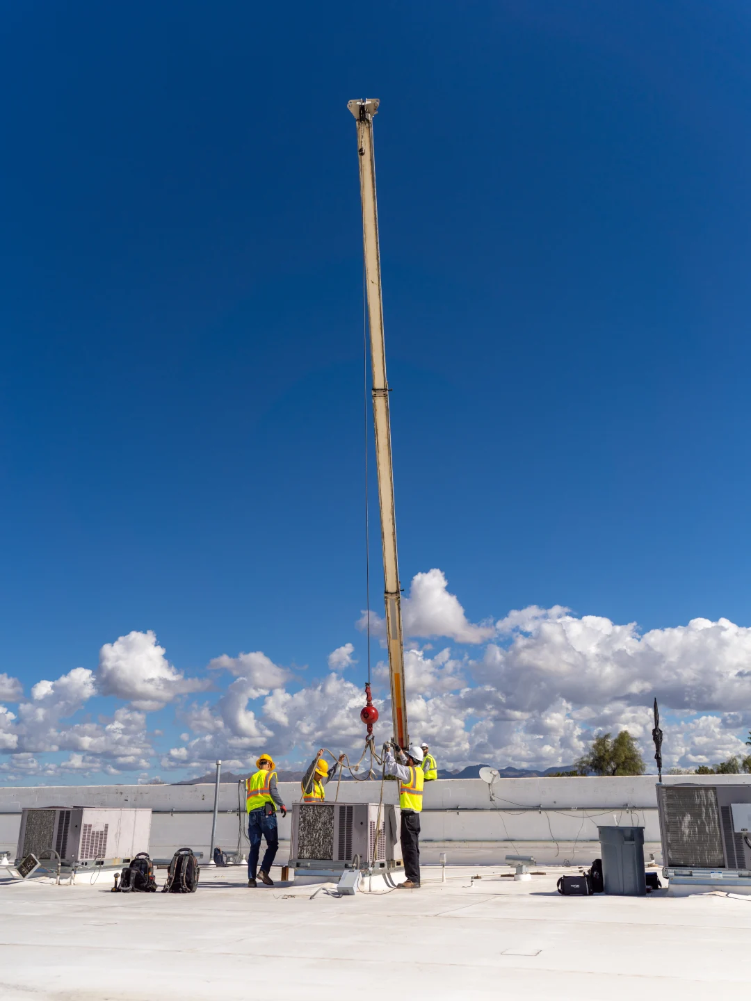 Done Rite Professional HVAC using crane for commercial AC install on rooftop in Tucson