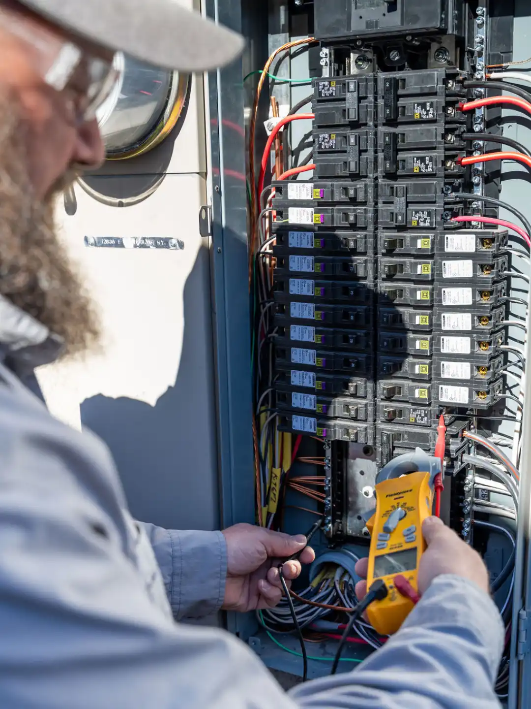 Done Rite electrician installing electrical panel in Tucson