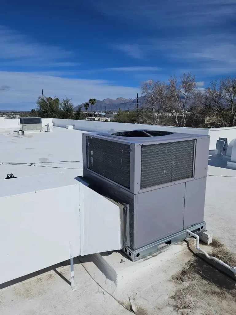 Done Rite Services technician repairing an air conditioner not cooling, on a rooftop to restore efficient operation.