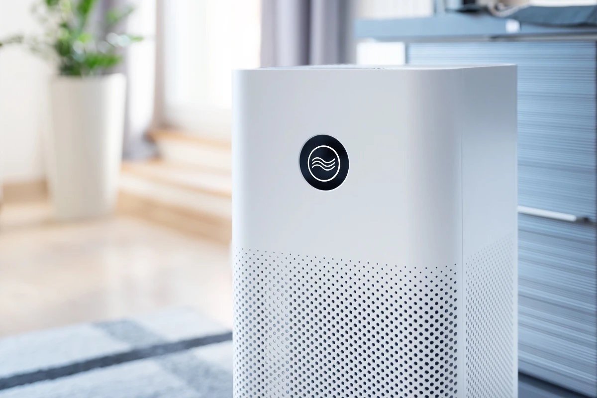 Compact air purifier in a living room, showcasing its design and fit for home air quality improvement.