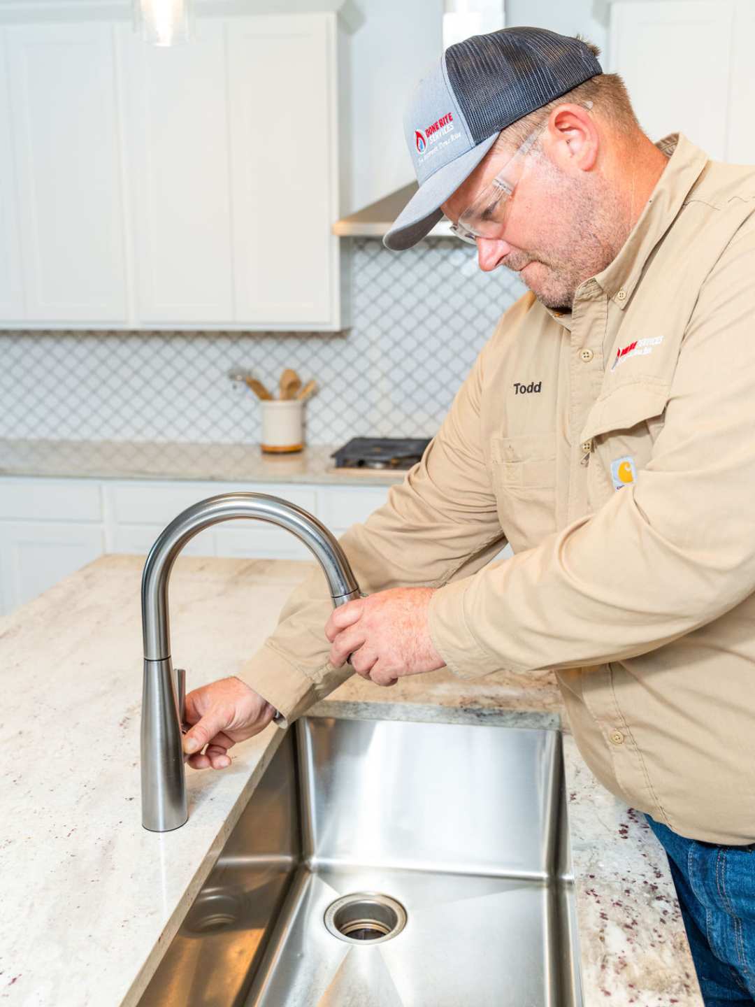 Expert plumber from Done Rite Services in Tucson skillfully repairing a leaky faucet to prevent water wastage.