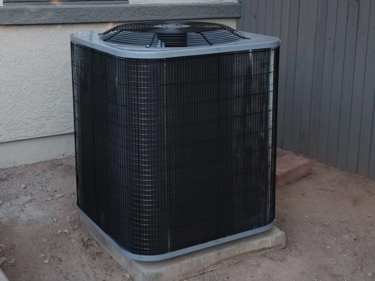 Outdoor unit of a modern heat pump system installed by Done Rite Service, showcasing sleek design.