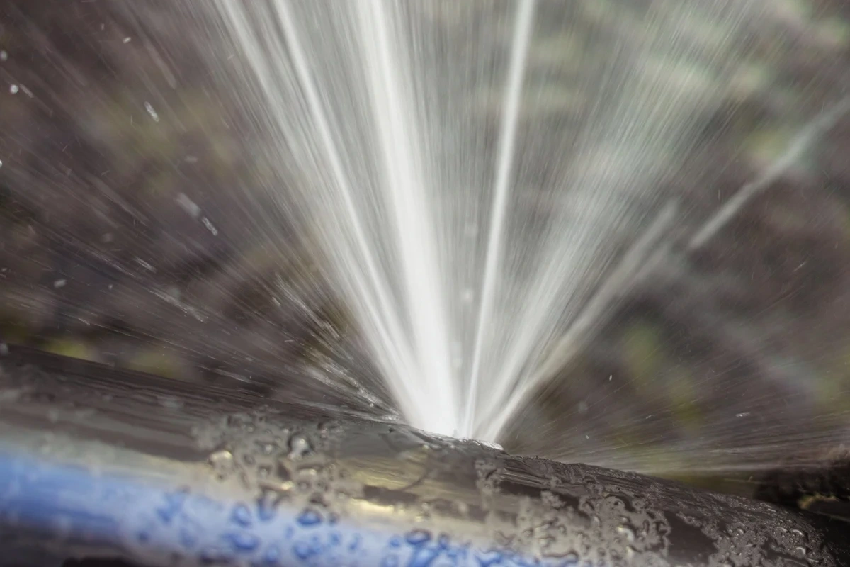 Image of a pipe burst indicating the need for immediate and essential plumbing repair