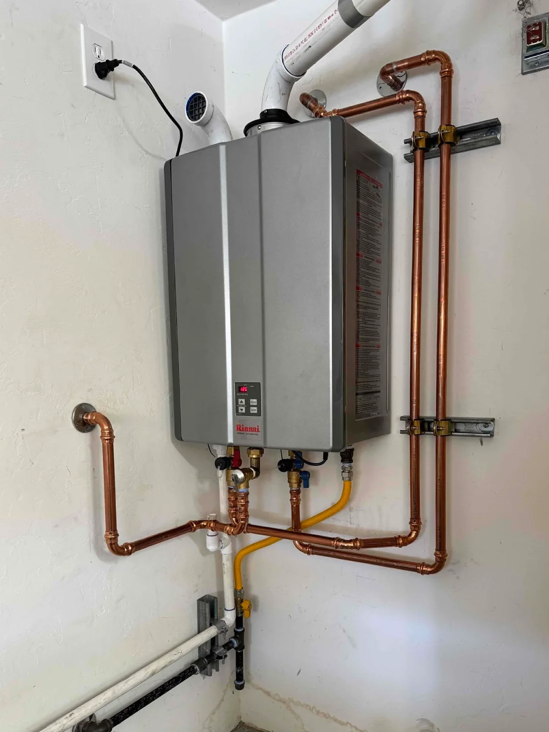 Done Rite Service completes a sleek tankless water heater installation, offering endless hot water with a modern design.