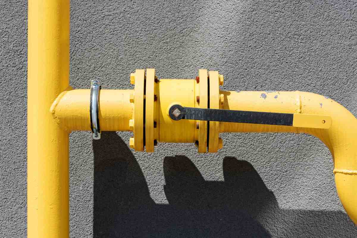 Close-up of a gas line pipe during an inspection by Done Right Services in Tucson, checking for damage.