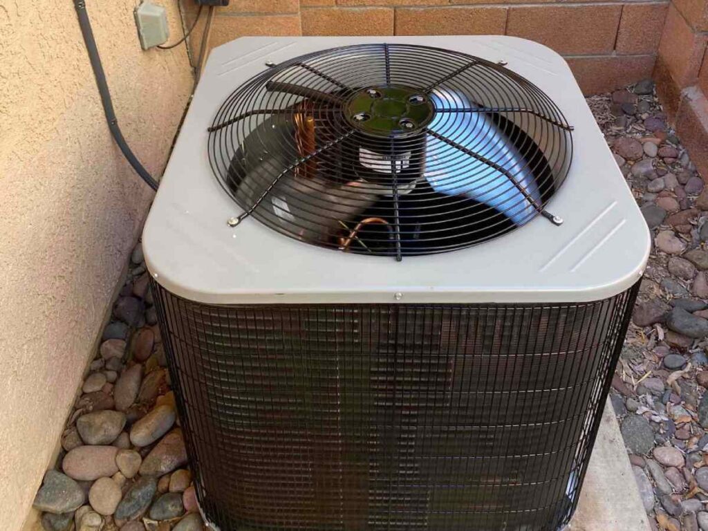 Air conditioning compressor installed outside a Tucson house, showing the best place for AC installation.