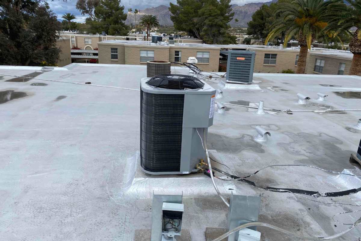 Done Rite Services HVAC technicians performing an emergency air conditioner repair on a commercial rooftop in Saddlebrooke.