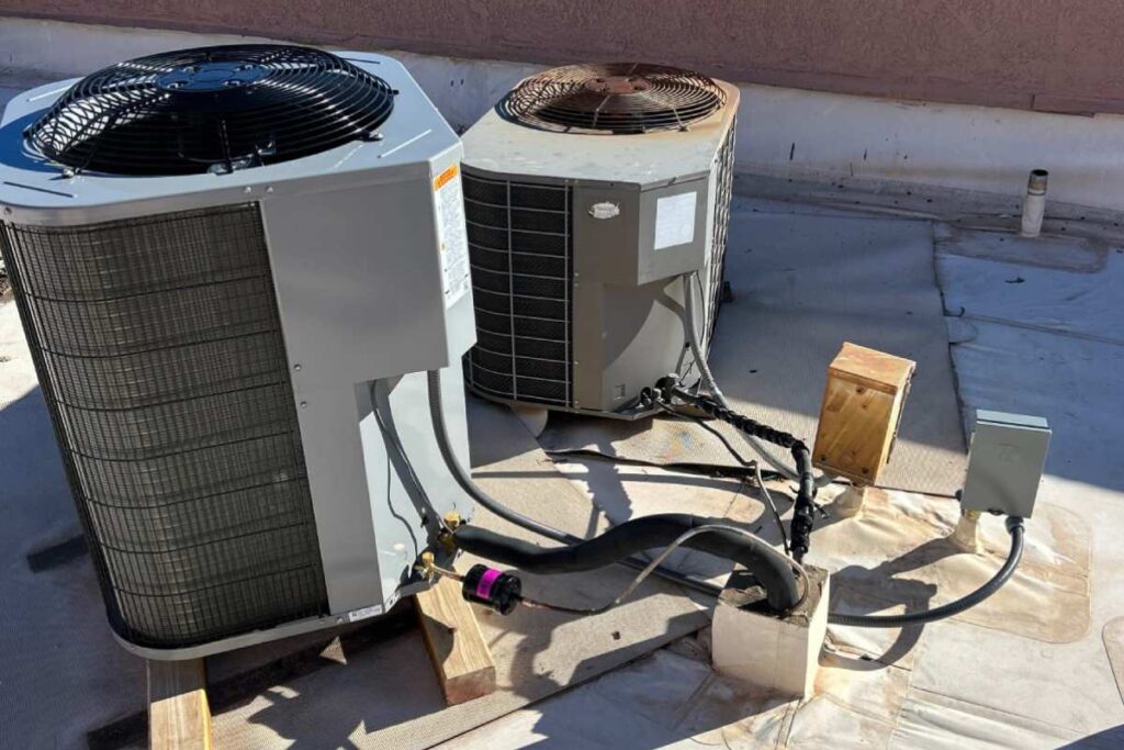 A new AC unit installed next to the old one, discussing factors that influence the cost of replacement.