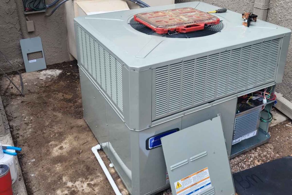 AC unit under routine maintenance by Done Rite Services expert HVAC technician