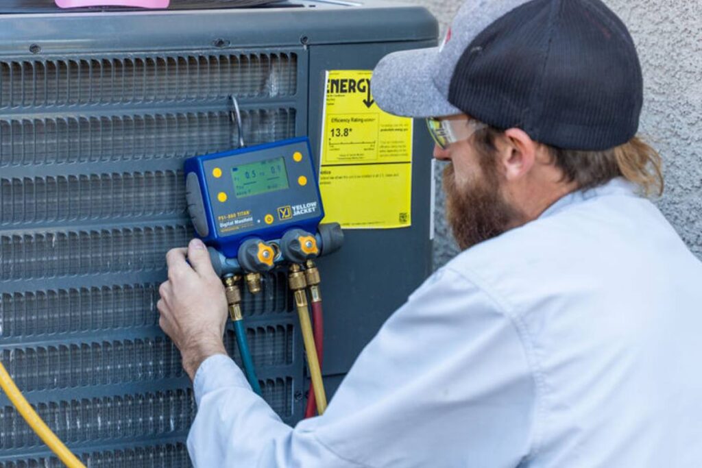 Done Rite Services HVAC technician inspecting an AC unit, explaining how SEER ratings affect savings.