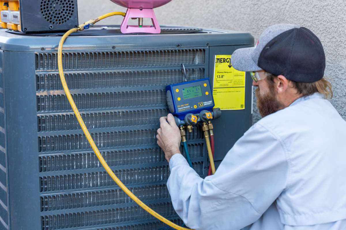 Done Rite Services HVAC technician testing refrigerant during air conditioner repair in Green Valley.