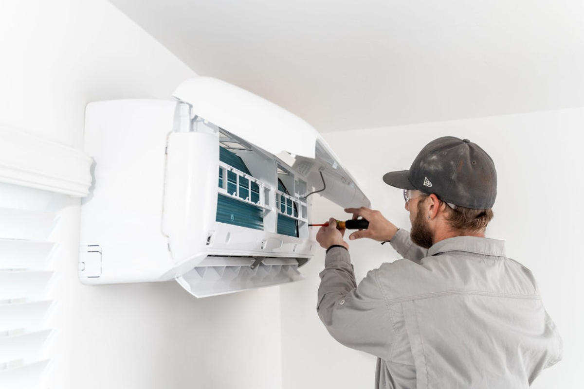 Done Rite Services expert HVAC technician installing a ductless mini-split system in Tucson.