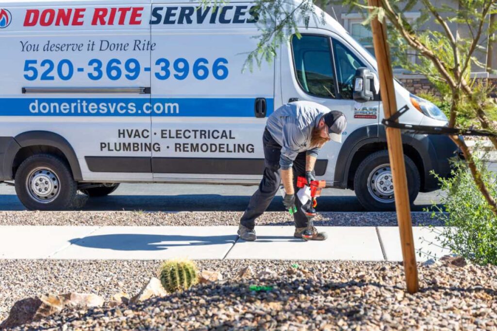 Done Rite Services expert plumber using advanced noninvasive technology to detect plumbing leaks in a Tucson home.