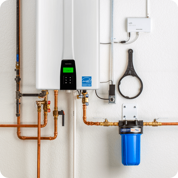 Done Rite Services plumbers standing next to a newly installed water heater in Oro Valley.